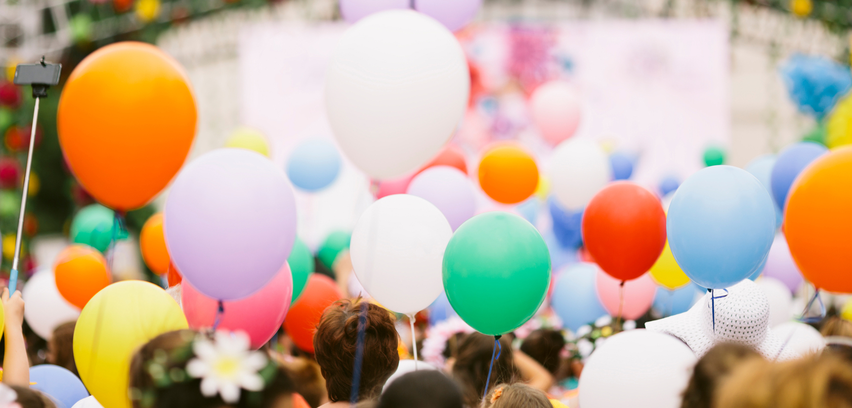 crowd with colorful balloons , selective focus
